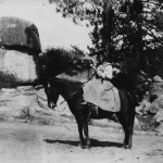 Mary Thomas on horseback by Hemet Lake